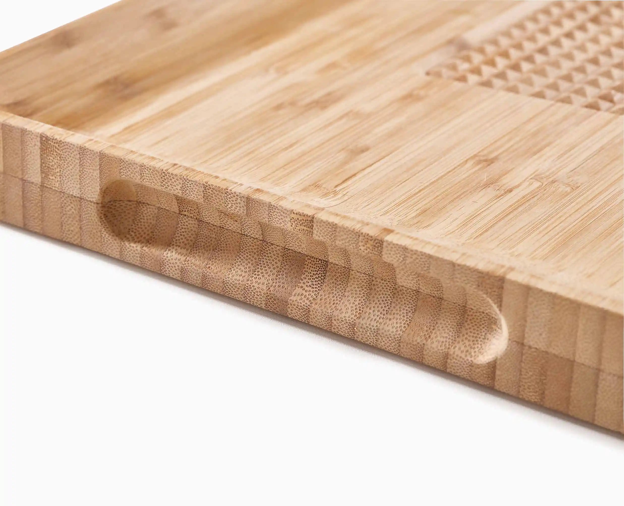 joseph-joseph-cut-carve-bamboo-chopping-board-with-integrated-food-grip image 5