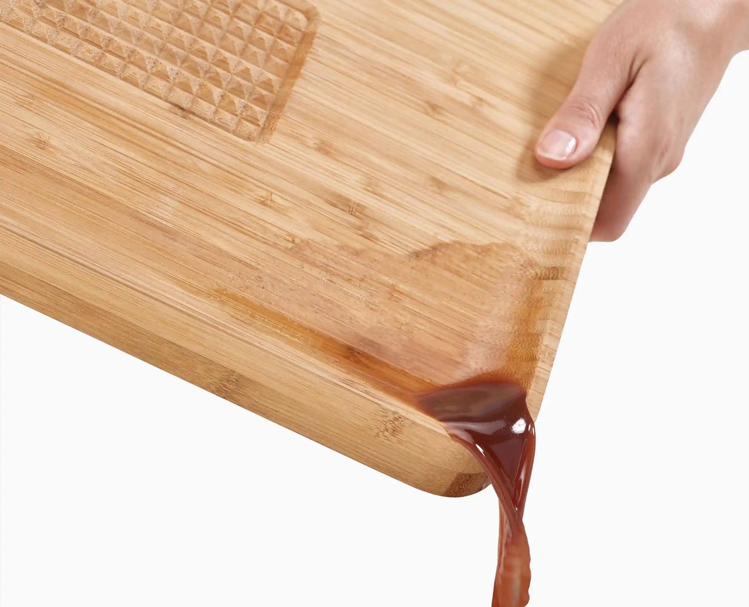 joseph-joseph-cut-carve-bamboo-chopping-board-with-integrated-food-grip image 7
